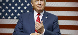 Republican presidential candidate Donald Trump speaks to supporters as he takes the stage for a campaign event in Dallas, Monday, Sept. 14, 2015. (AP Photo/LM Otero)