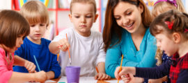 Group Of Elementary Age Children In Art Class With Teacher