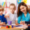 Group Of Elementary Age Children In Art Class With Teacher